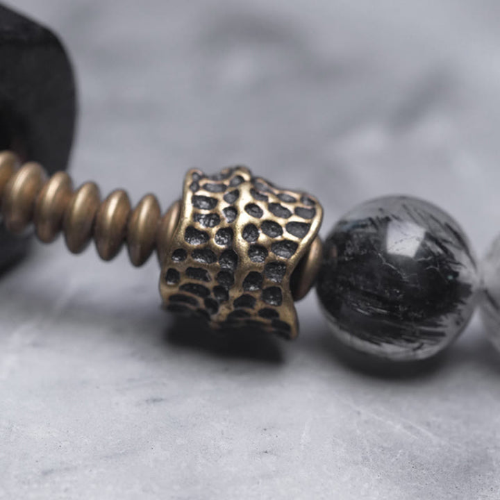 Braccialetto con bilanciere a doppio giro in ottone e rame, in legno di ebano e quarzo rutilato nero Buddha Stones