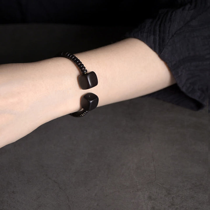 Braccialetto di equilibrio a cubo in legno di sandalo verde e legno di ebano Buddha Stones