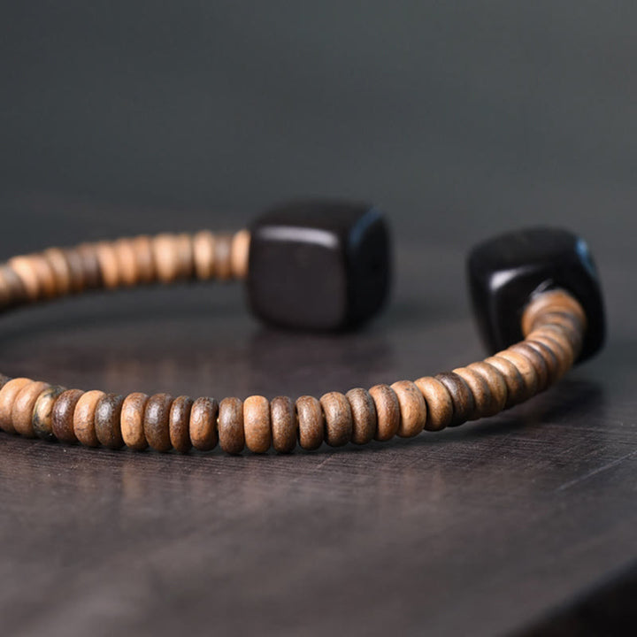 Braccialetto di equilibrio a cubo in legno di sandalo verde e legno di ebano Buddha Stones