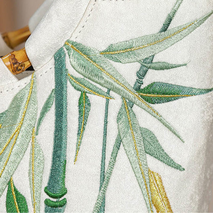 Borse con nappine e manici in bambù ricamati con Buddha Stones