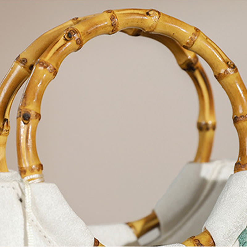 Borse con nappine e manici in bambù ricamati con Buddha Stones