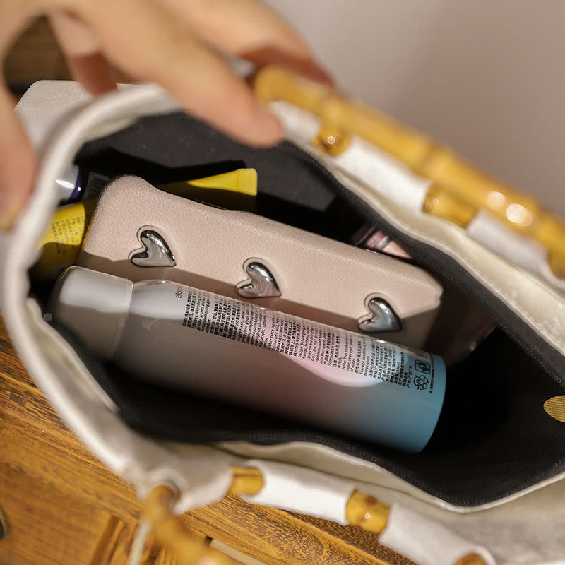 Borse con nappine e manici in bambù ricamati con Buddha Stones