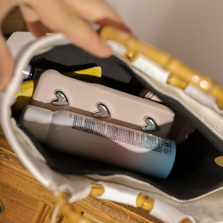 Borse con nappine e manici in bambù ricamati con Buddha Stones