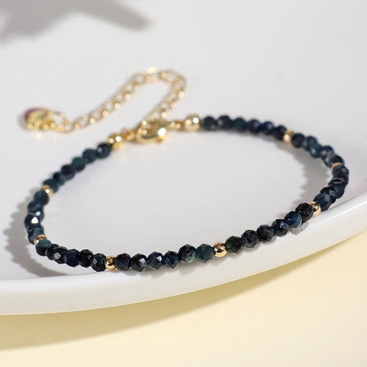 Braccialetto della saggezza con perle di rame, tormalina e indicolite Buddha Stones