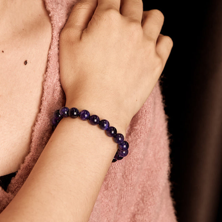 Braccialetto della creatività con occhio di tigre viola Buddha Stones