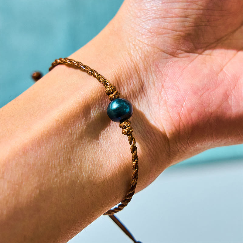 Braccialetto della saggezza in corda di cera con perle nere di Tahiti naturali Buddha Stones