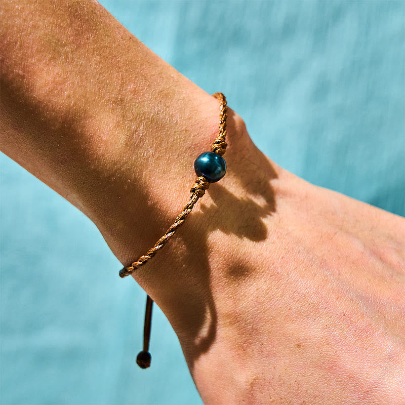 Braccialetto della saggezza in corda di cera con perle nere di Tahiti naturali Buddha Stones