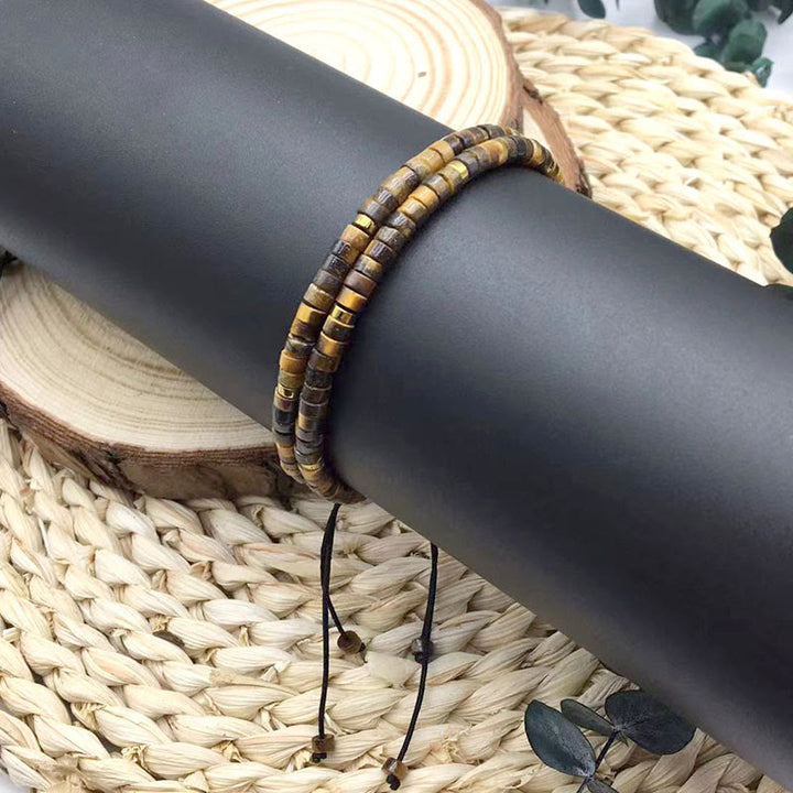 Braccialetto di perline distanziatrici in occhio di tigre naturale Buddha Stones