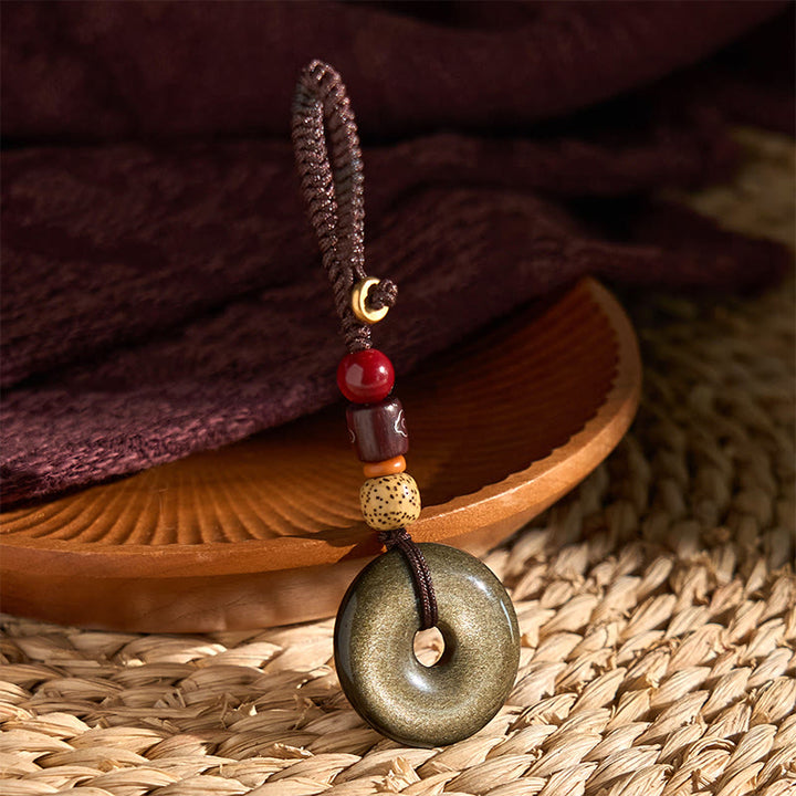 Buddha Stones Oro Naturale Lucente Ossidiana Fibbia della Pace Rafforza Portachiavi