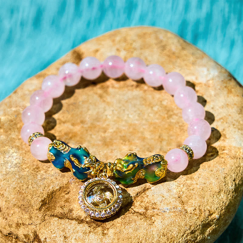 Braccialetto con ciondolo a forma di ciclone PiXiu Buddha Stones e cristallo rosa che cambia colore