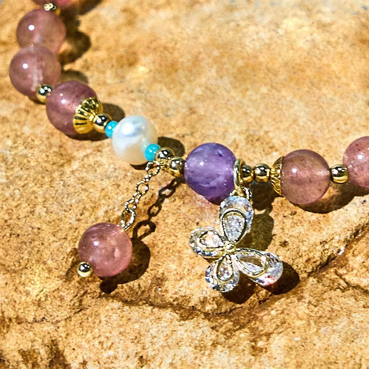 Braccialetto con ciondolo a farfalla in quarzo fragola verde con Buddha Stones e quarzo fragola naturale