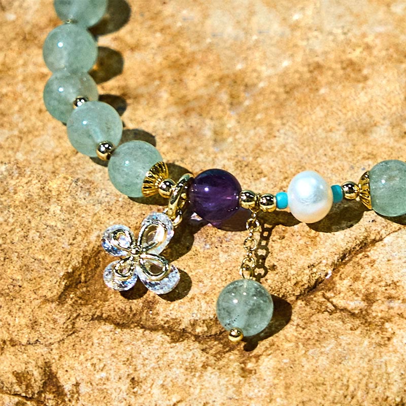 Braccialetto con ciondolo a farfalla in quarzo fragola verde con Buddha Stones e quarzo fragola naturale