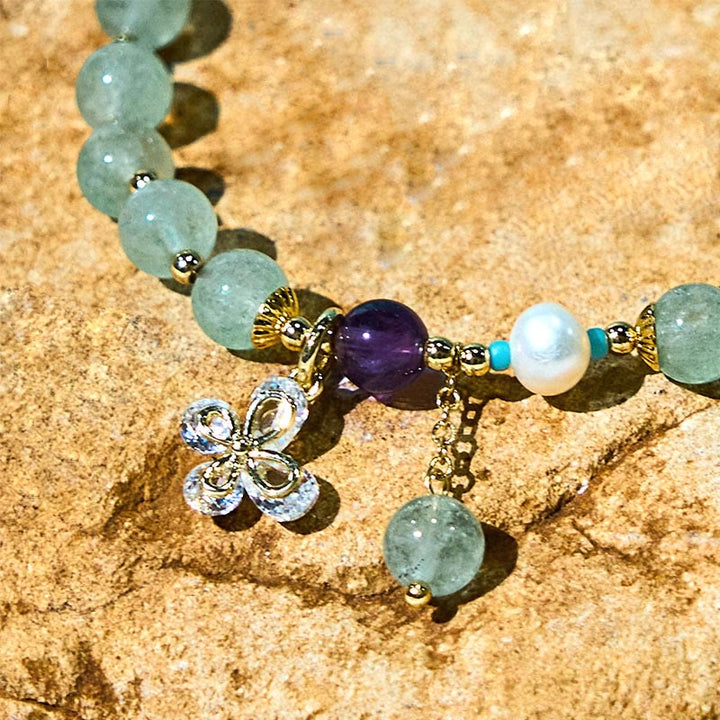 Braccialetto con ciondolo a farfalla in quarzo fragola verde con Buddha Stones e quarzo fragola naturale