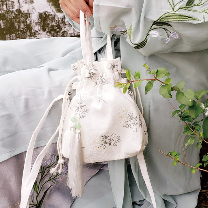 Borsa a tracolla in tela con fiori bianchi e foglie verdi, motivo Buddha Stones