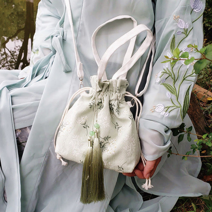 Borsa a tracolla in tela con fiori bianchi e foglie verdi, motivo Buddha Stones