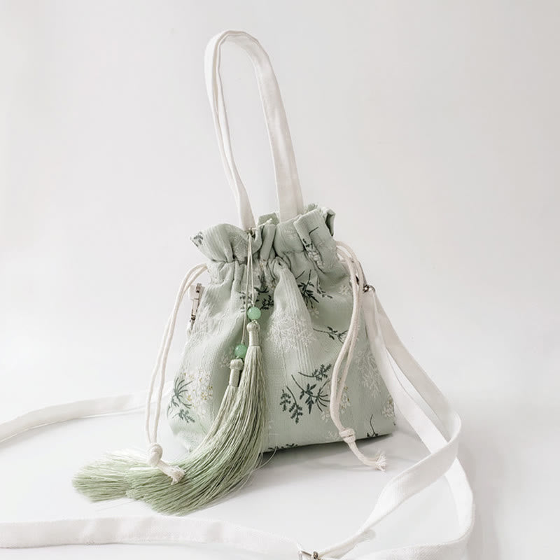 Borsa a tracolla in tela con fiori bianchi e foglie verdi, motivo Buddha Stones