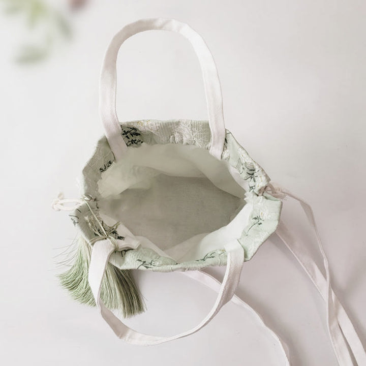 Borsa a tracolla in tela con fiori bianchi e foglie verdi, motivo Buddha Stones