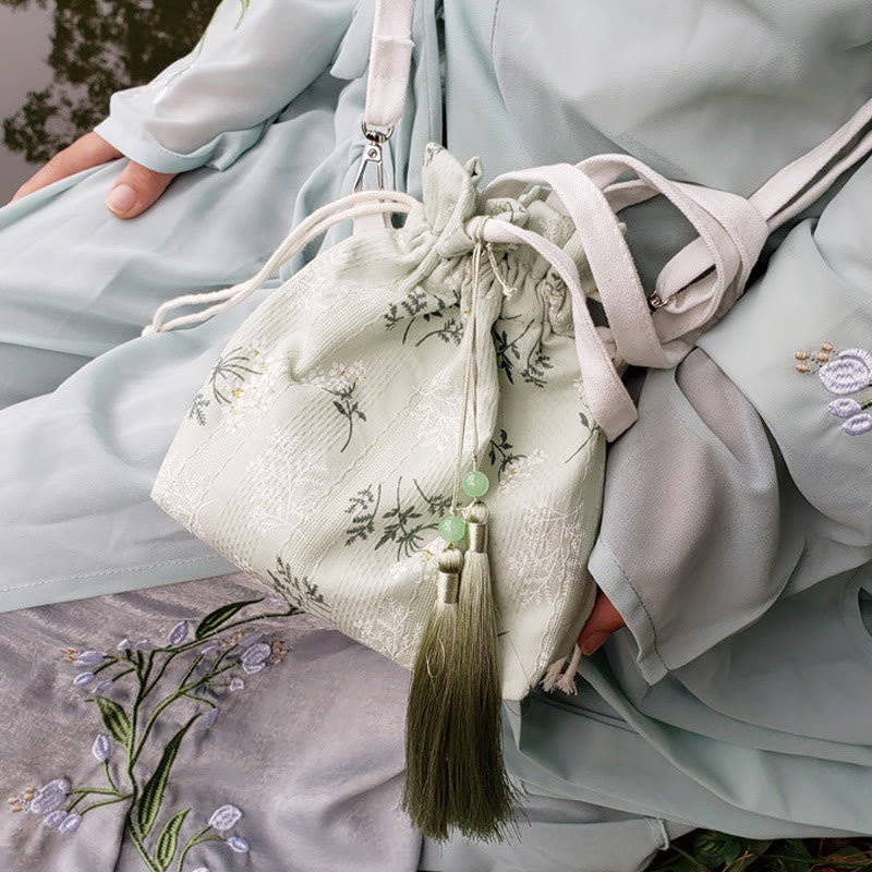 Borsa a tracolla in tela con fiori bianchi e foglie verdi, motivo Buddha Stones