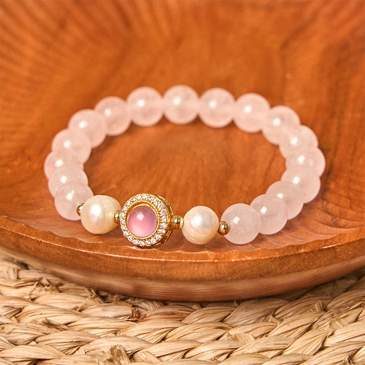 Braccialetto Buddha Stones con perle di cristallo rosa e calore