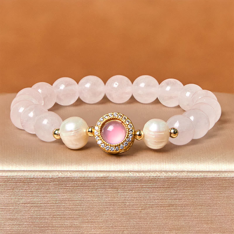 Braccialetto Buddha Stones con perle di cristallo rosa e calore