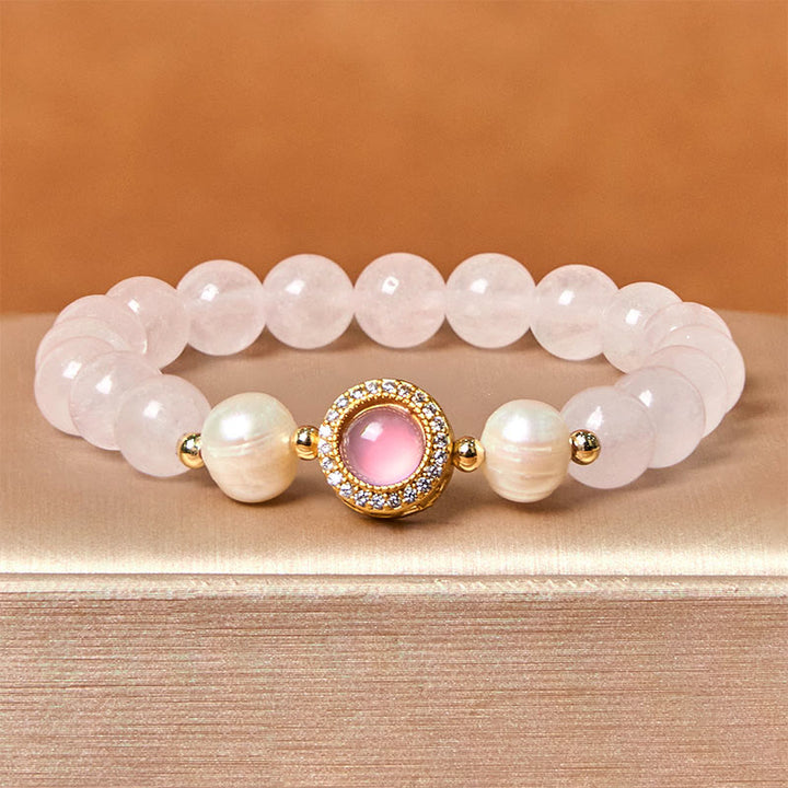 Braccialetto Buddha Stones con perle di cristallo rosa e calore