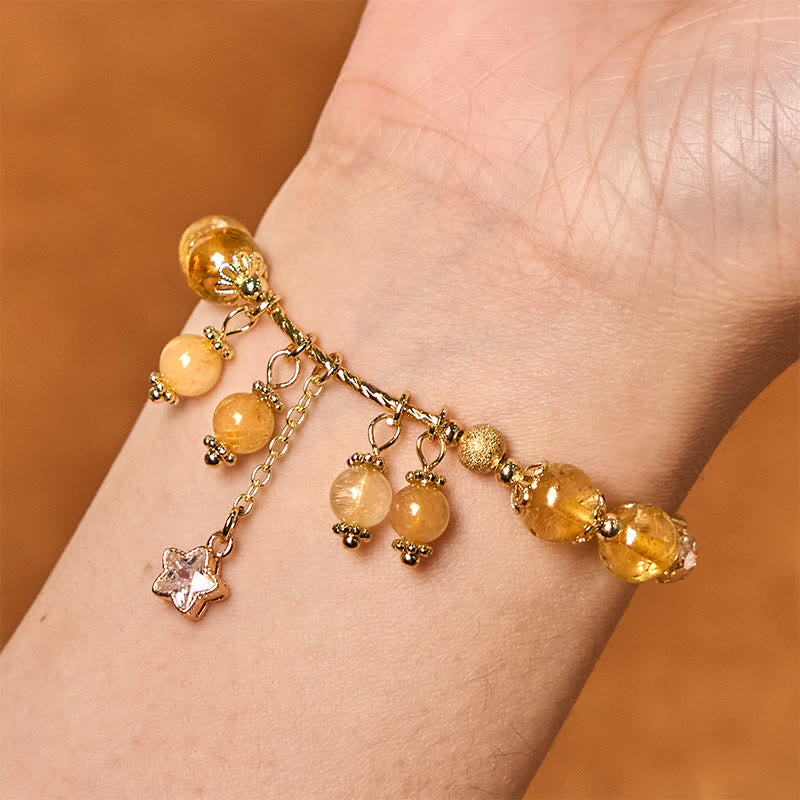 Braccialetto di auspicio con stelle a quadrifoglio e quarzo rutilato giallo colorato naturale di Buddha Stones