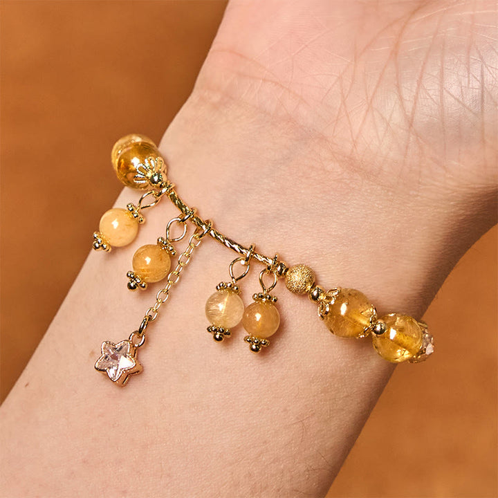 Braccialetto di auspicio con stelle a quadrifoglio e quarzo rutilato giallo colorato naturale di Buddha Stones