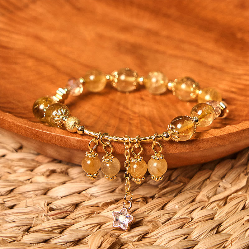Braccialetto di auspicio con stelle a quadrifoglio e quarzo rutilato giallo colorato naturale di Buddha Stones