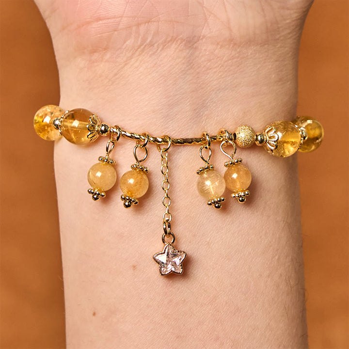 Braccialetto di auspicio con stelle a quadrifoglio e quarzo rutilato giallo colorato naturale di Buddha Stones