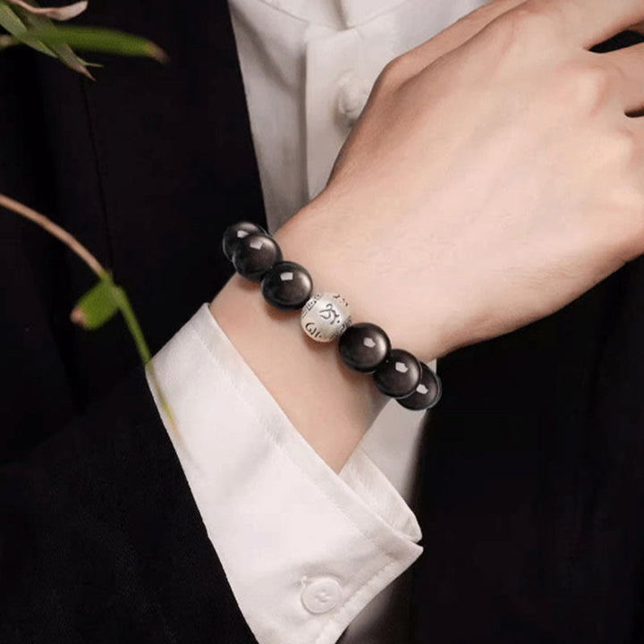 Bracciale di protezione Om Mani Padme Hum in ossidiana naturale lucida e argento Buddha Stones