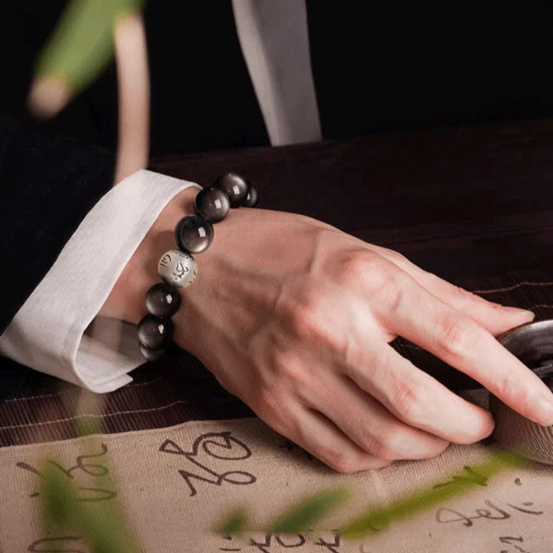 Bracciale di protezione Om Mani Padme Hum in ossidiana naturale lucida e argento Buddha Stones