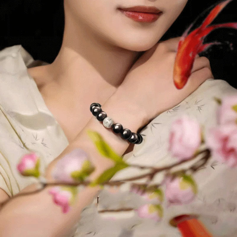 Bracciale di protezione Om Mani Padme Hum in ossidiana naturale lucida e argento Buddha Stones