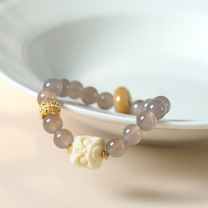 Bracciale Buddha Stones Ambra Grigio Agata Avorio Frutta Confidenza