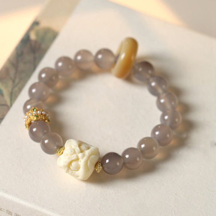 Bracciale Buddha Stones Ambra Grigio Agata Avorio Frutta Confidenza