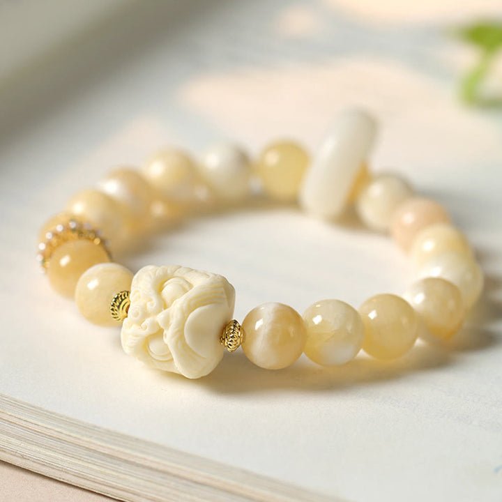 Bracciale Buddha Stones Ambra Grigio Agata Avorio Frutta Confidenza
