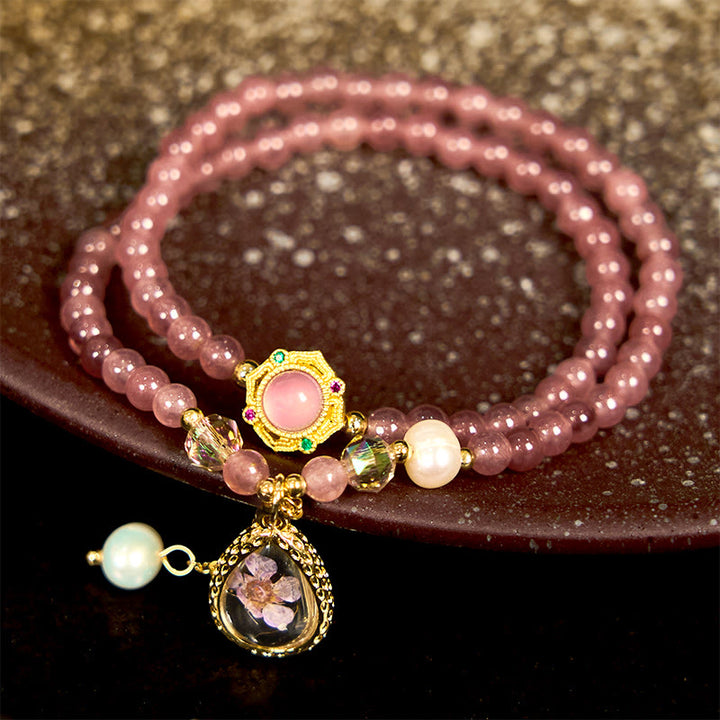 Bracciale Buddha Stones con quarzo fragola naturale, perla, farfalla, goccia d'acqua, positivo, doppio giro