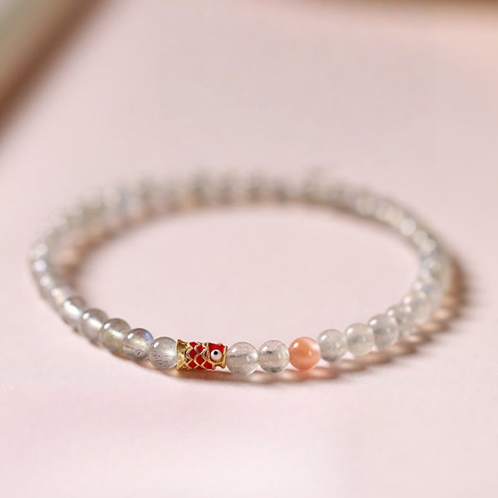 Braccialetto curativo ultrasottile Buddha Stones con pietra di luna e pesce koi