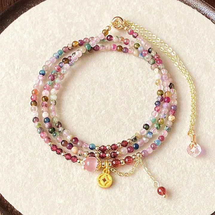 Bracciale della saggezza con moneta di tormalina colorata e perline irregolari da 2,5 mm Buddha Stones
