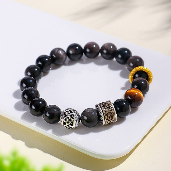 Bracciale di protezione Om Mani Padme Hum in ossidiana lucida color argento Buddha Stones
