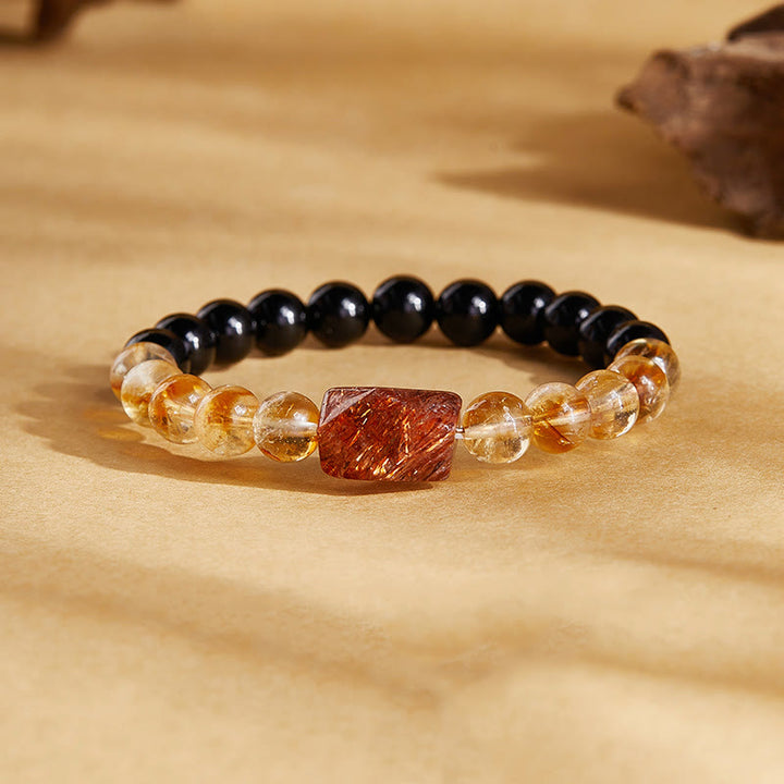 Bracciale Buddha Stones con cristalli di ossidiana nera naturale e citrino Super Seven Strength