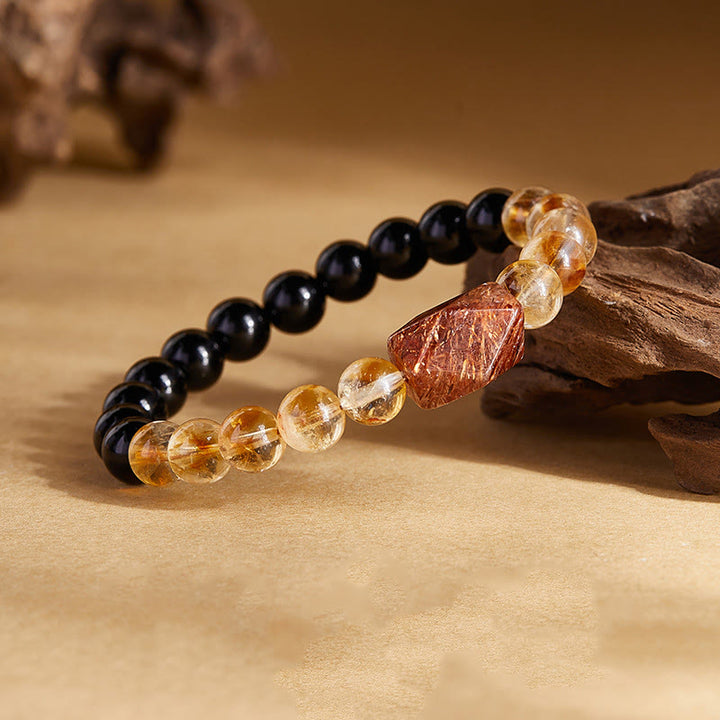 Bracciale Buddha Stones con cristalli di ossidiana nera naturale e citrino Super Seven Strength