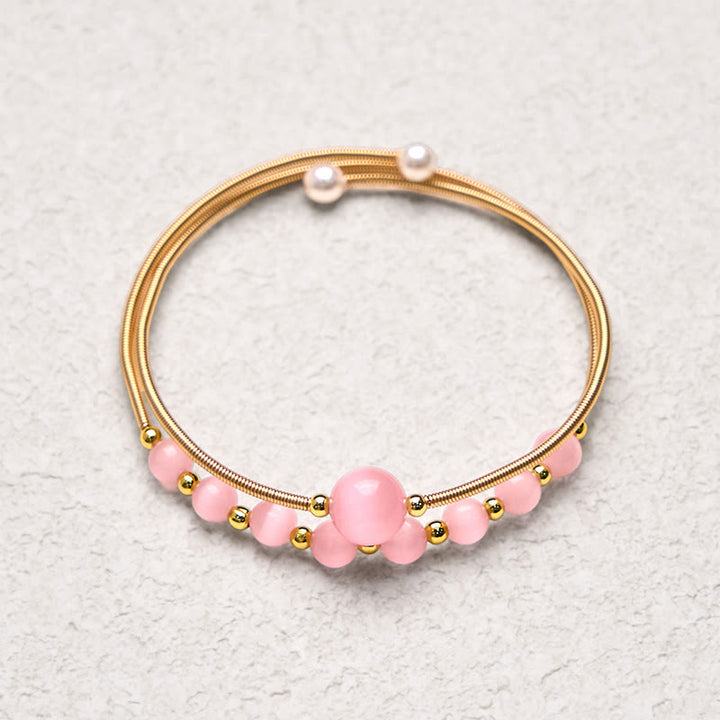 Bracciale rigido in metallo con supporto per occhio di gatto rosa in rame riempito d'oro 14K Buddha Stones