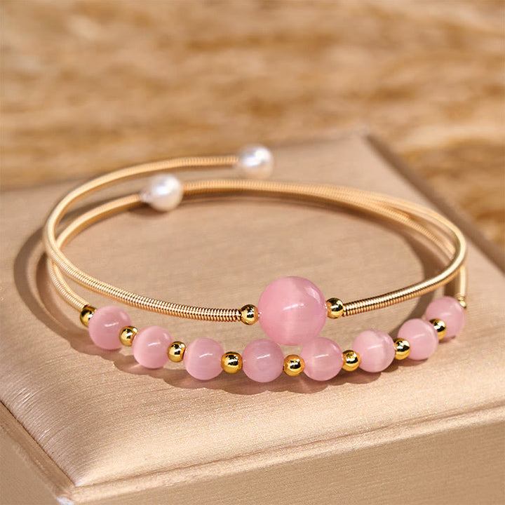 Bracciale rigido in metallo con supporto per occhio di gatto rosa in rame riempito d'oro 14K Buddha Stones