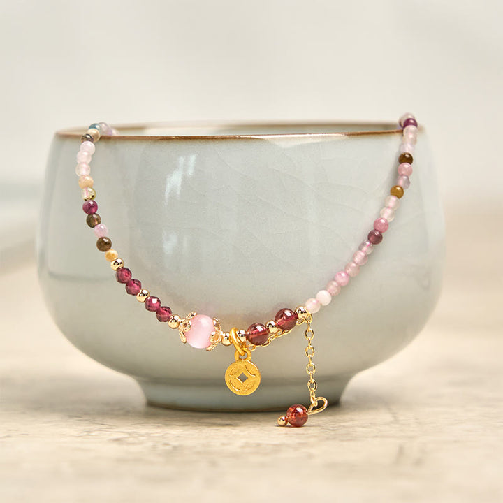 Bracciale della saggezza con moneta di tormalina colorata e perline irregolari da 2,5 mm Buddha Stones