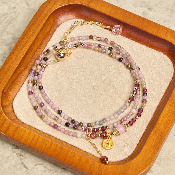 Bracciale della saggezza con moneta di tormalina colorata e perline irregolari da 2,5 mm Buddha Stones