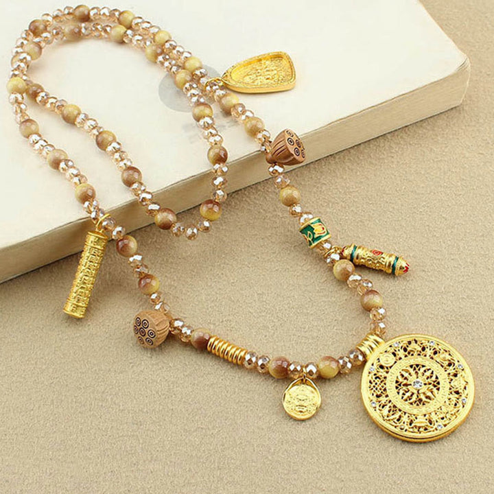 Collana con ciondolo in perle di occhio di tigre dorato, piastra rotonda tibetana con Buddha Stones e loto - image 3