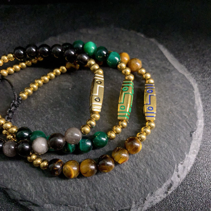 Braccialetto con perline di coraggio in occhio di tigre con motivo a osso e Buddha Stones - image 14