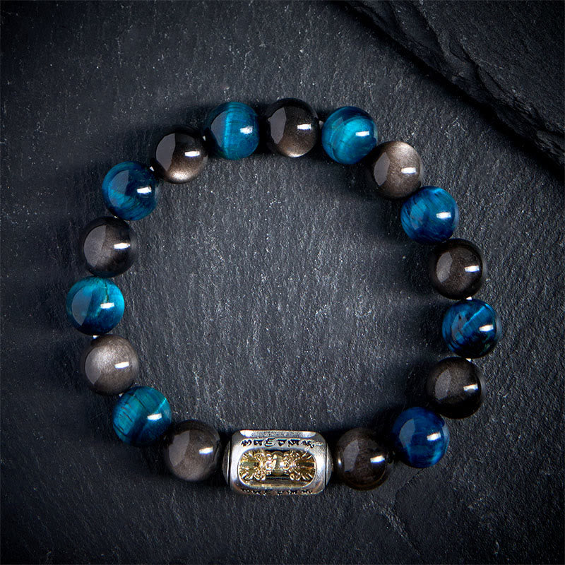 Braccialetto rilassante Om Mani Padme Hum in ossidiana blu con Buddha Stones in argento naturale e occhio di tigre - image 1
