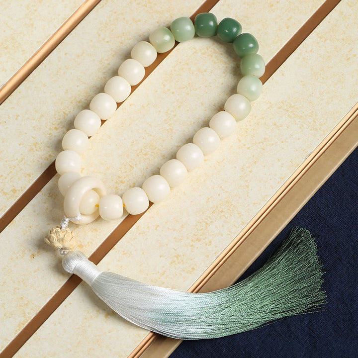 Buddha Stones Naturale Gradiente Bodhi Seed Fortuna Sacchetto di Denaro Loto Saggezza Nappa Polso Mala