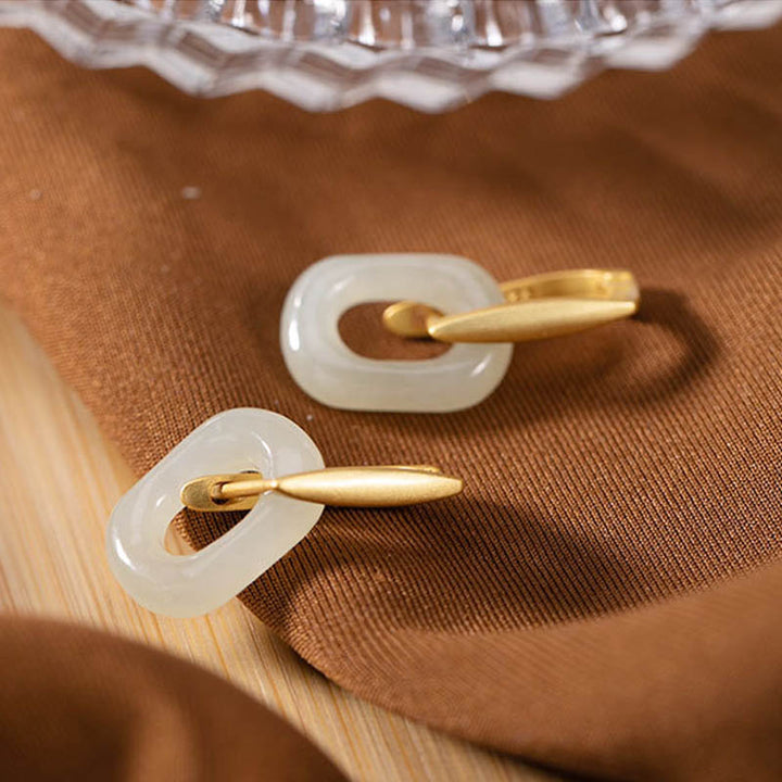 Orecchini Buddha Stones in argento sterling 925 con giada bianca rotonda e benedizione della felicità